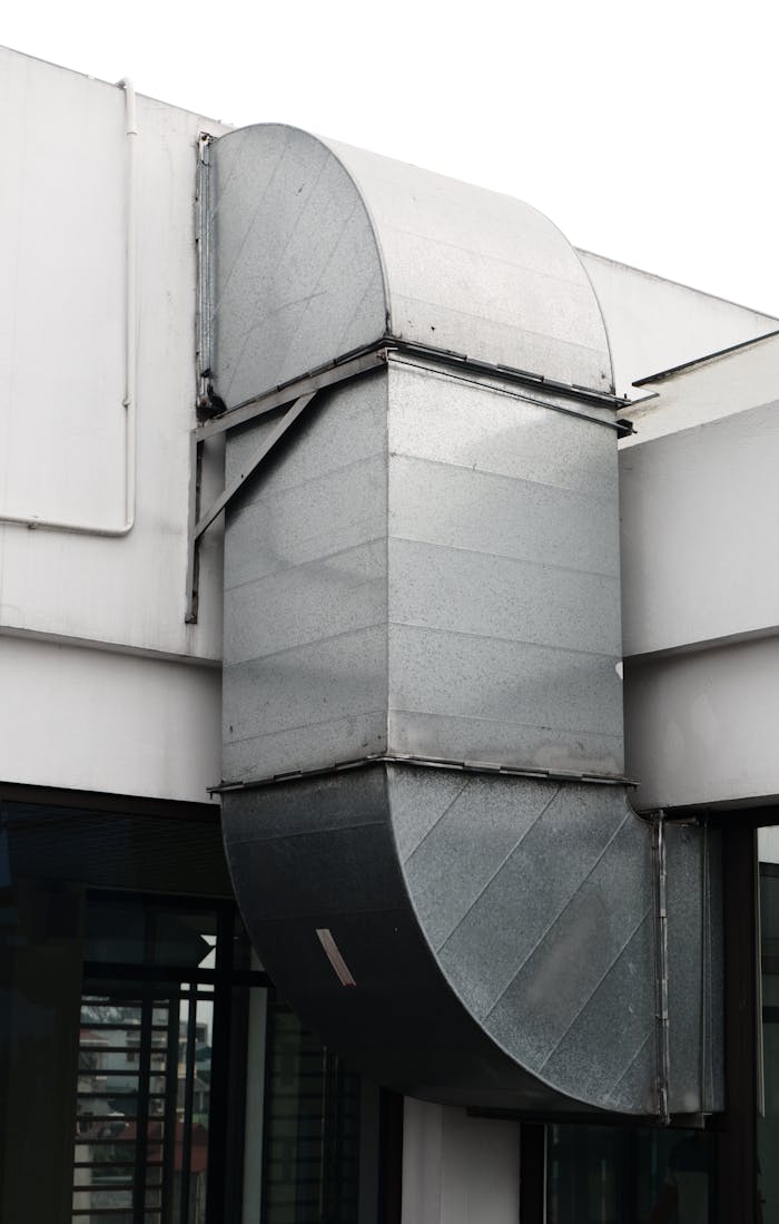 Mastering the First Impression: Your intriguing post title goes here Close-up of a contemporary ventilation duct exterior in a city setting.