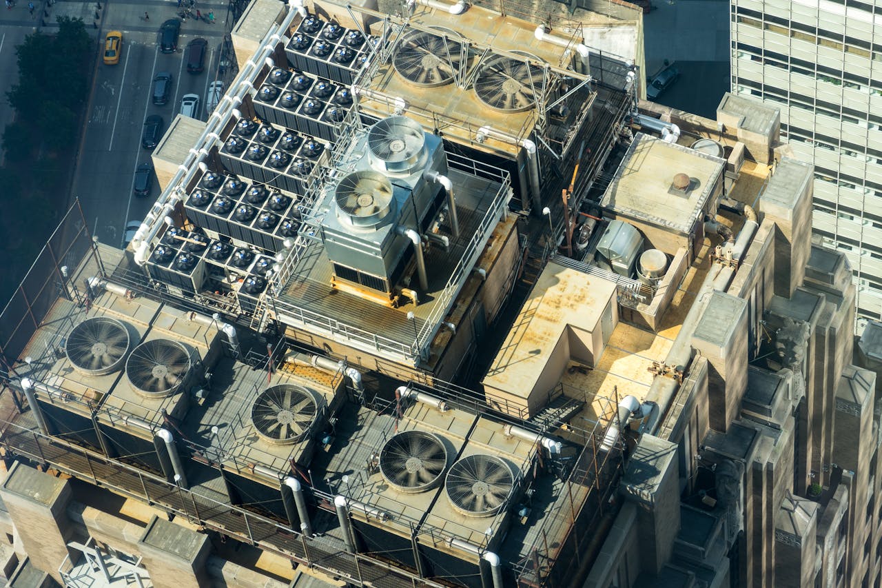 Crafting Captivating Headlines: Your awesome post title goes here High-angle shot of HVAC units on a city building's rooftop, showcasing industrial infrastructure.